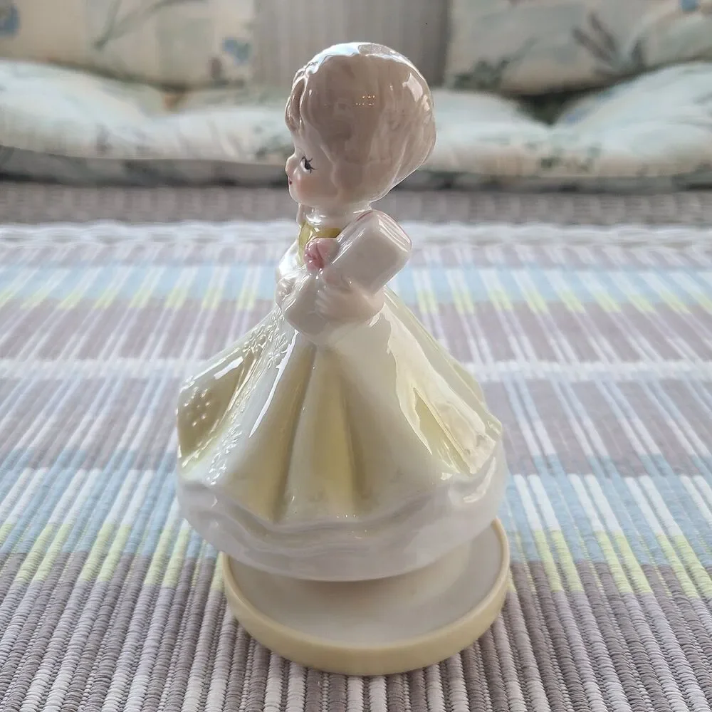 RARE Music Box Figurine With Lovely Young Girl Holding A Gift Plays Look Of Love